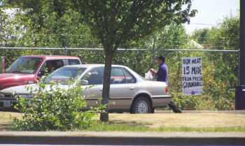 An employee walks right past the sign!