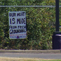 The sign is hung!  From the parking lot across the street