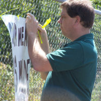 RBCP hanging the sign